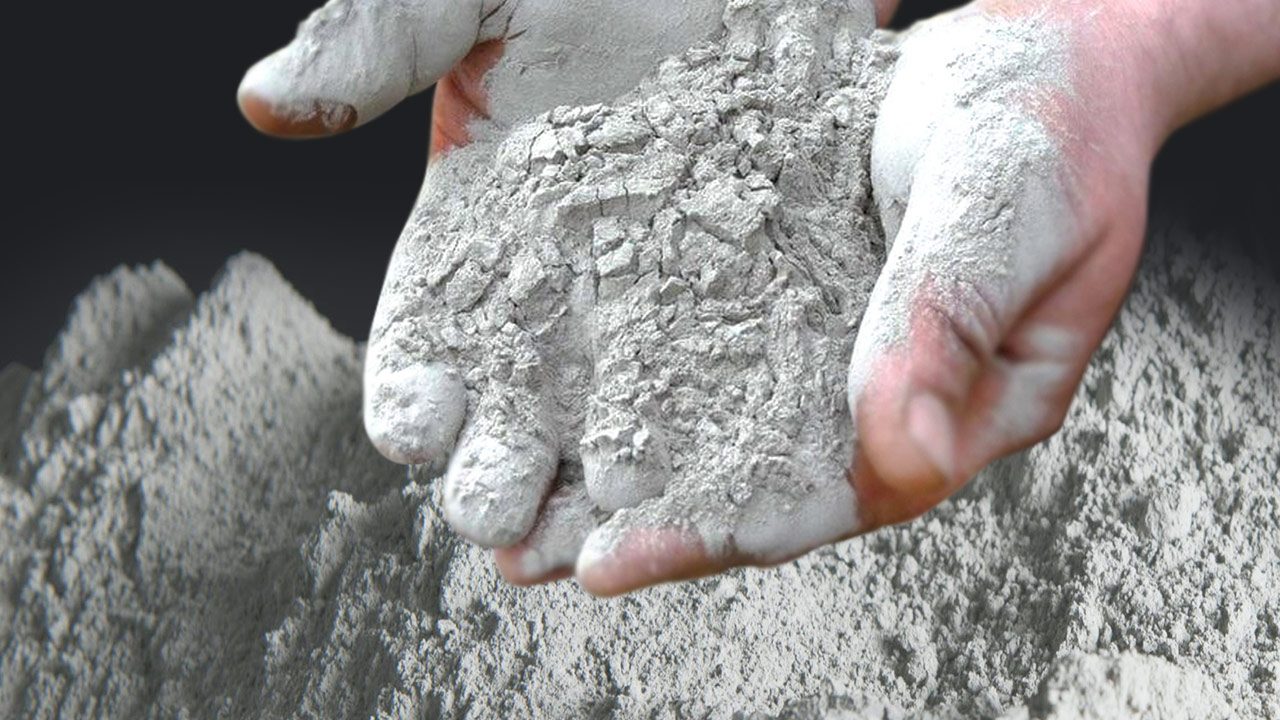Polymer mortar powder blend in hands